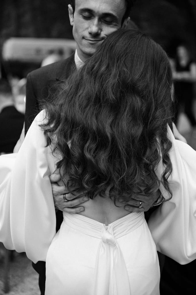 candid photo of couple holding each other, dancing or hugging in documentary film style