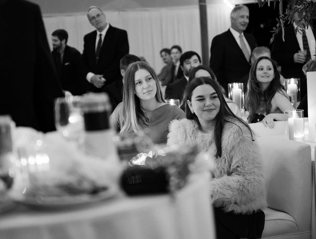 guests candid photo during speeches in black and white